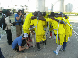 Haiti amputee football team gathers in prayer.
